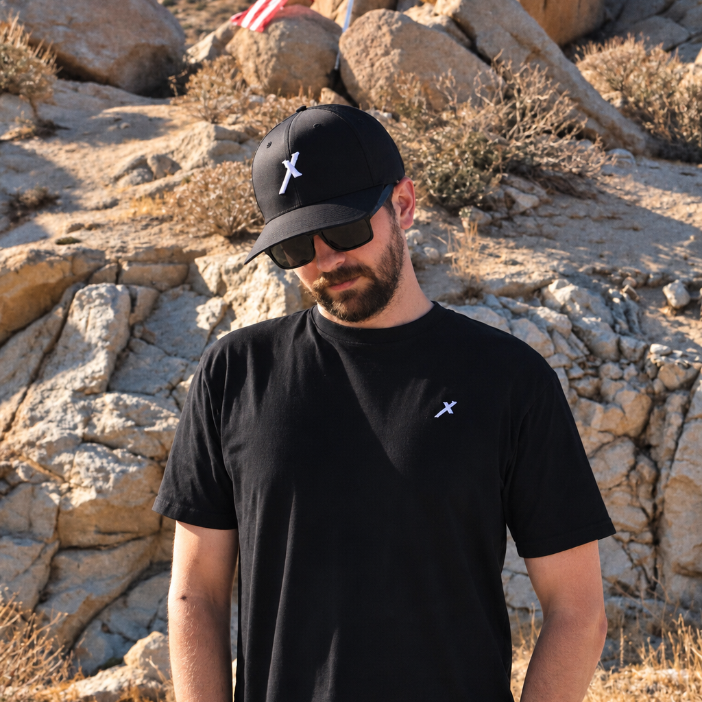 Man wearing Black Every Knee Will Bow Catholic Shirt, front chest logo. Model is 5'11" and wearing a Large